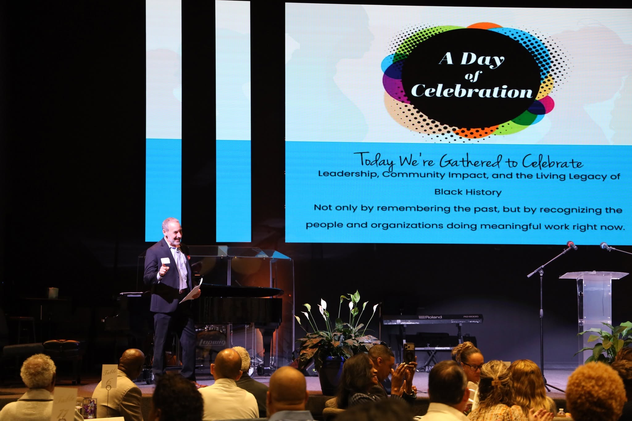 Jay speaking in an auditorium